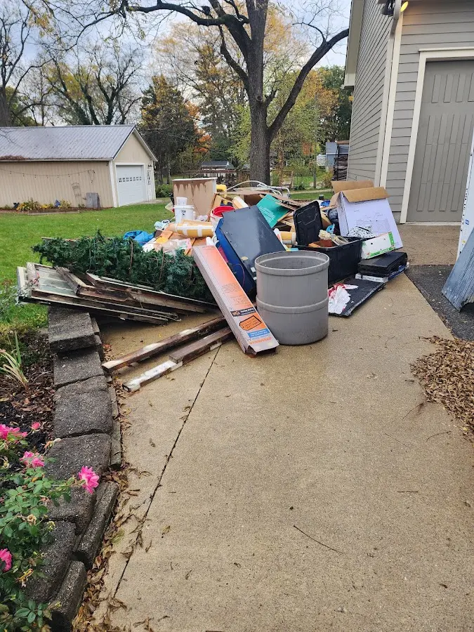 Dumpster being loaded with debris for Demolition Dumpster Rental in Salida